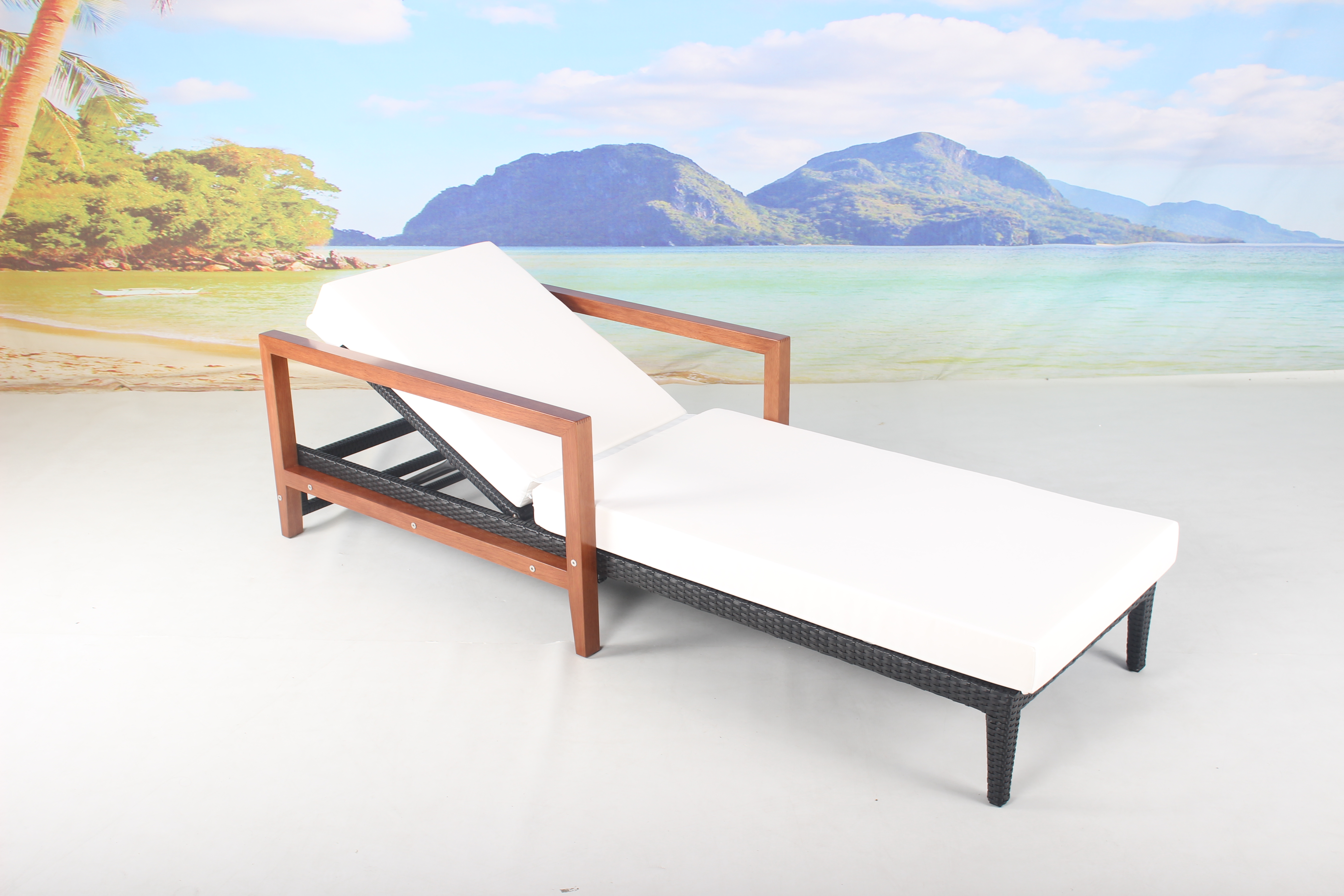 Hotel poolside rattan sun lounger with armrest