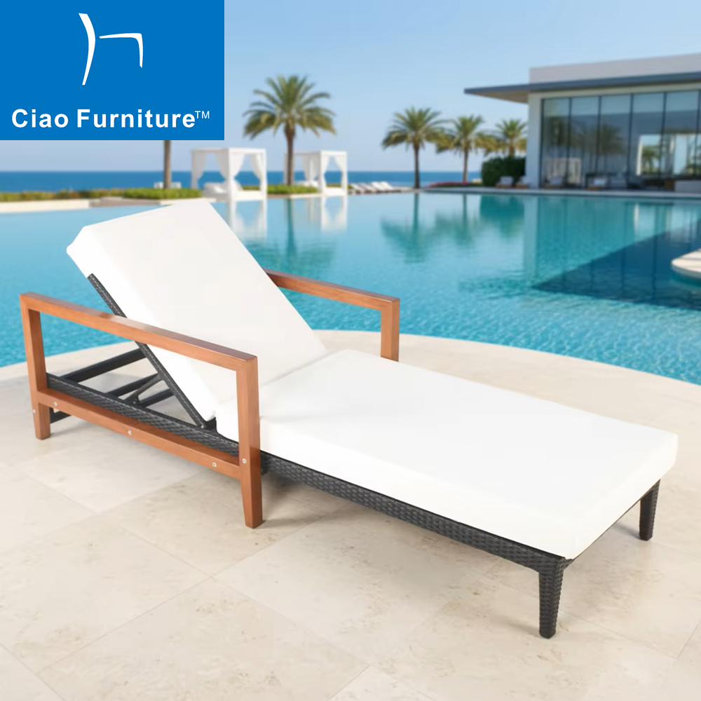 Hotel poolside rattan sun lounger with armrest