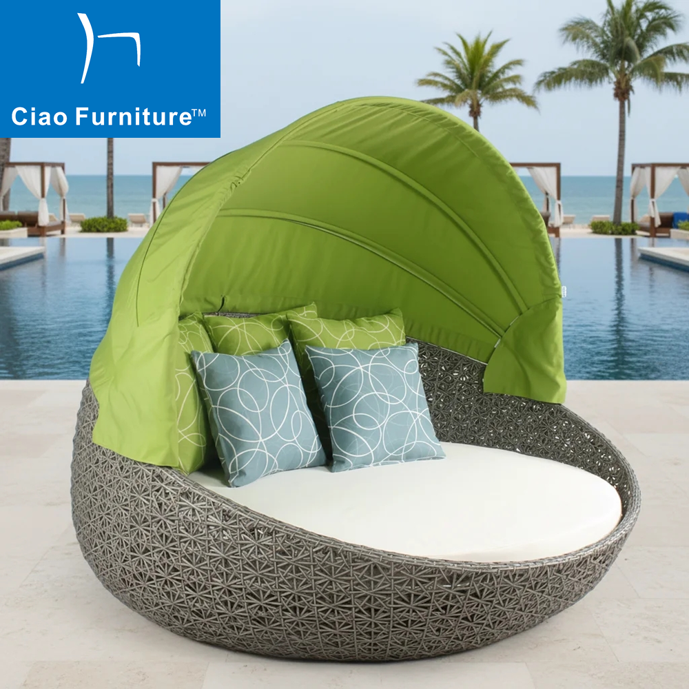 Resort outdoor wicker lounge daybed with green canopy 
